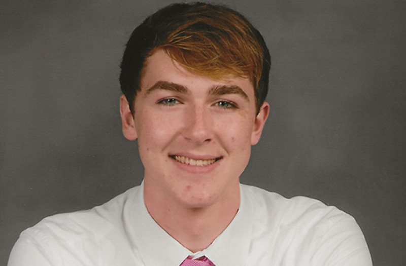 A young man in a dress shirt and tie.